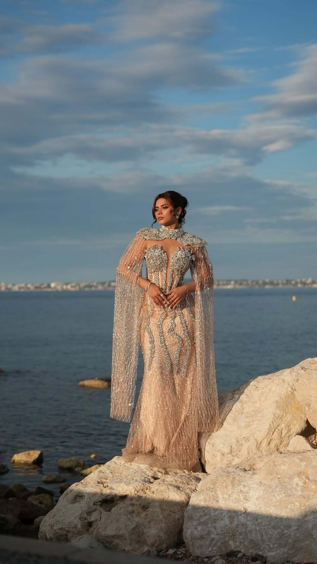 Nagma Mirajkar
Nagma Mirajkar made a striking Cannes 2026 appearance in a crystal diamond gown by Tasmim Zobaear. The ensemble featured a sheer, heavily embellished silhouette with intricate crystal detailing.
